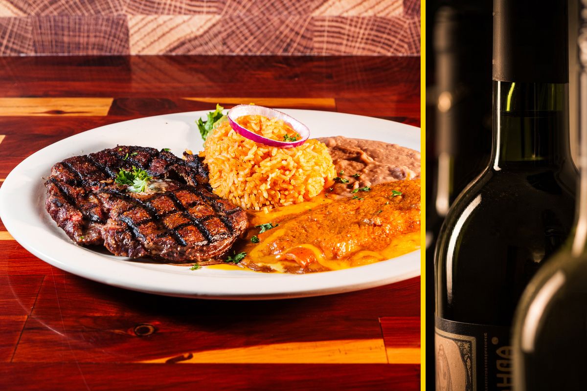 Grilled steak plate with rice and enchilada, and wine bottles
